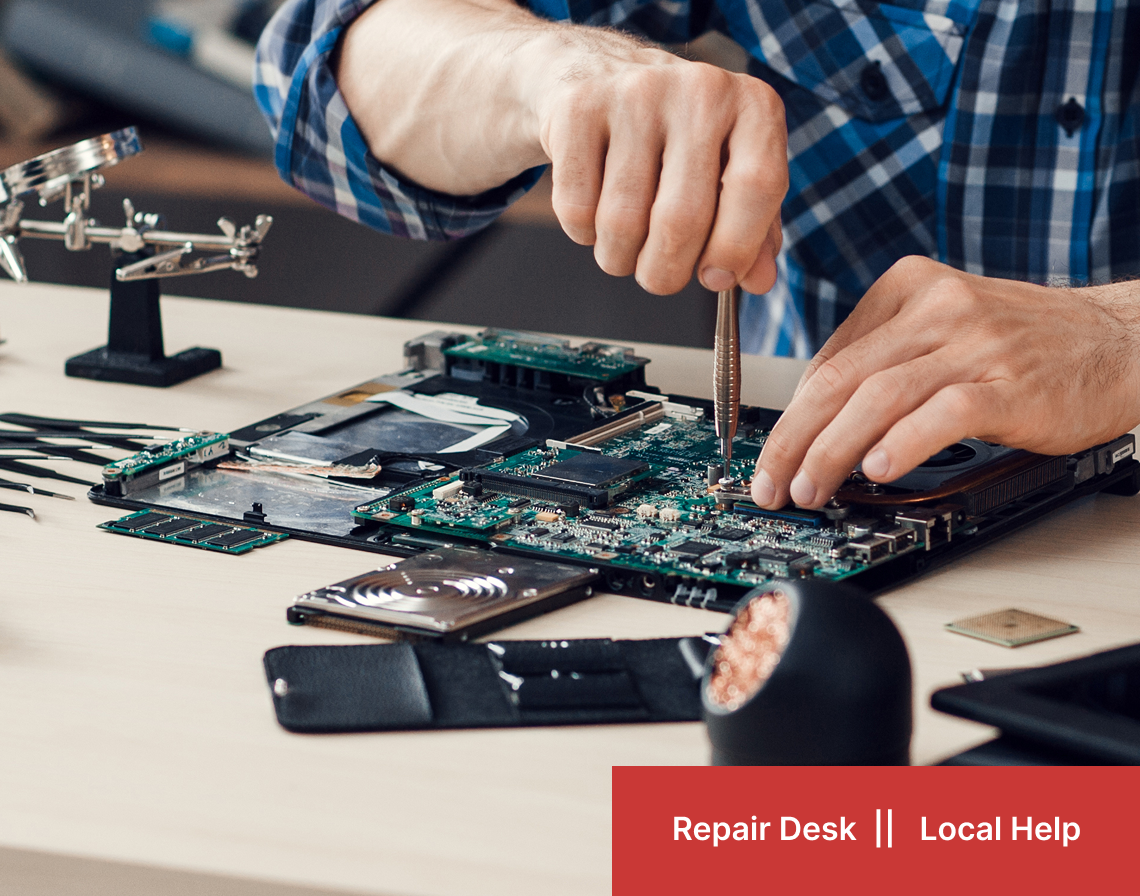 Computer repair technician working on motherboard