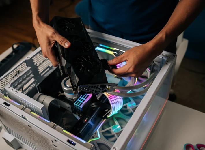 Hands setting up gaming PC